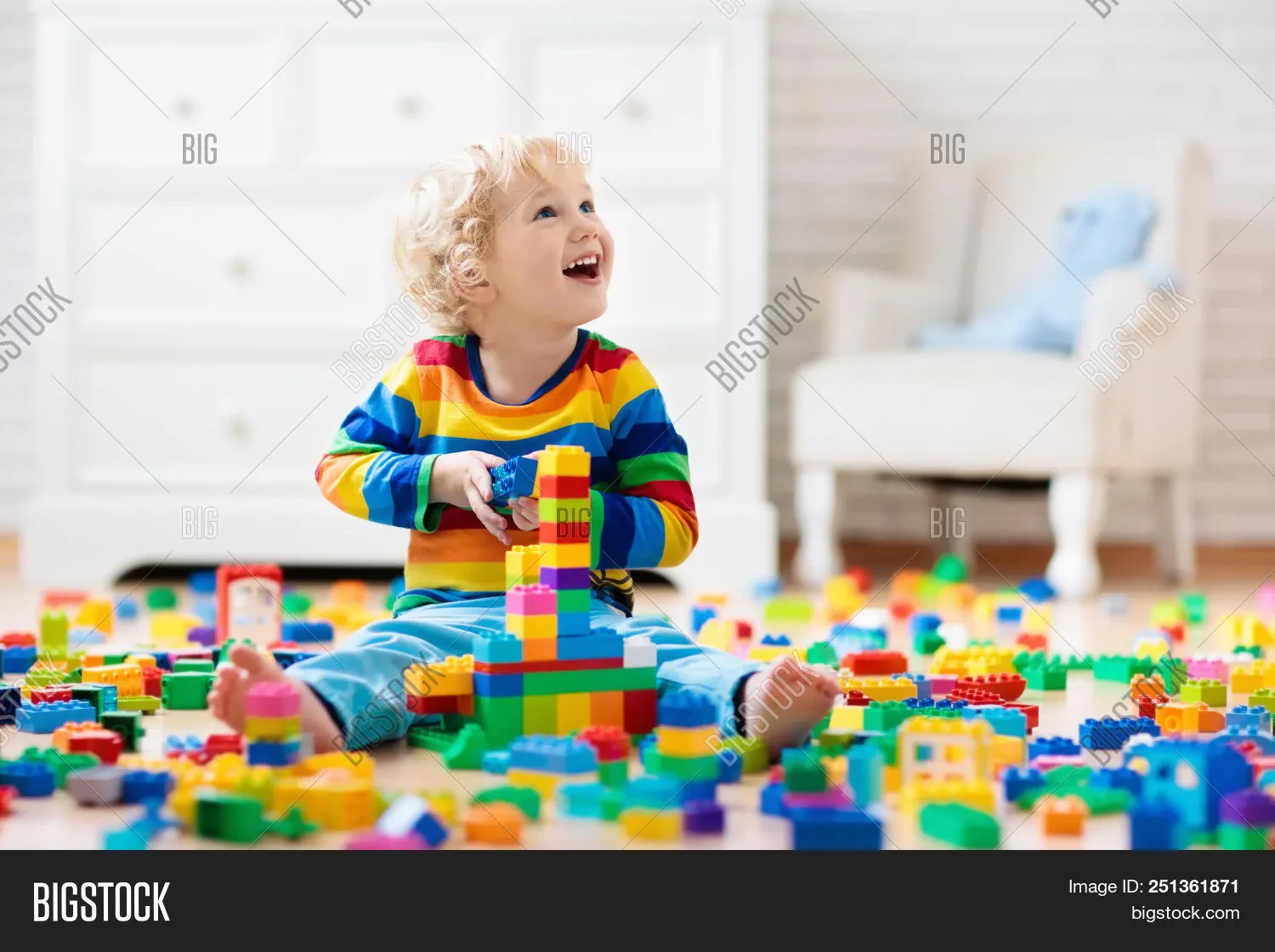 Child playing with Bruder toys