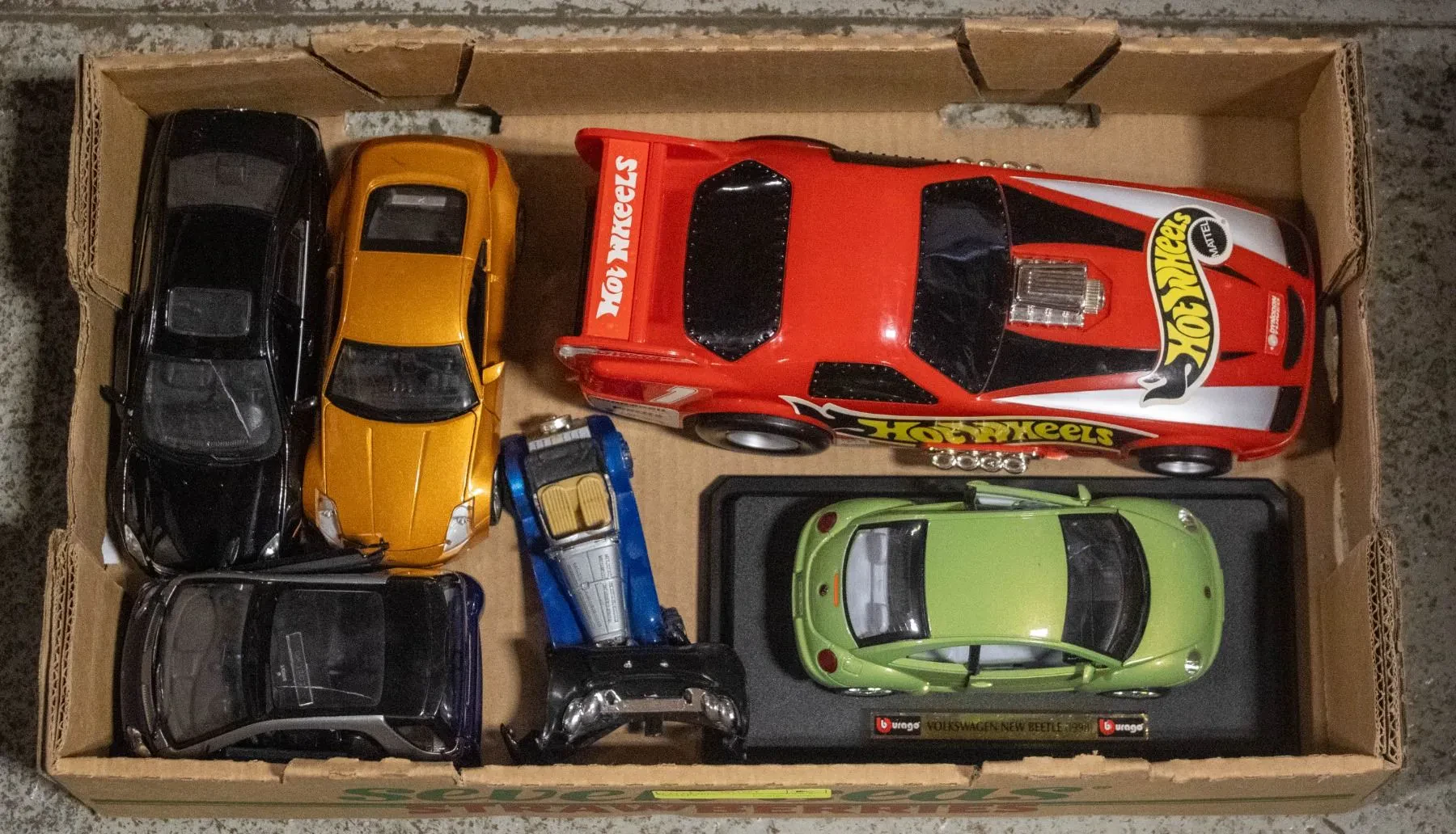 Different scales of diecast cars